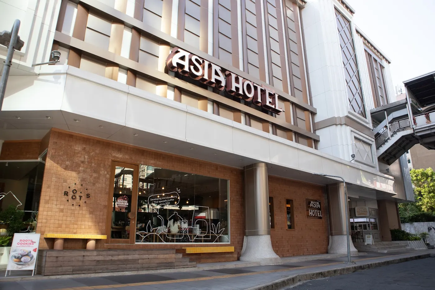 Asia Hotel sign at the Phayathai Road entrance beside the BTS skytrain line