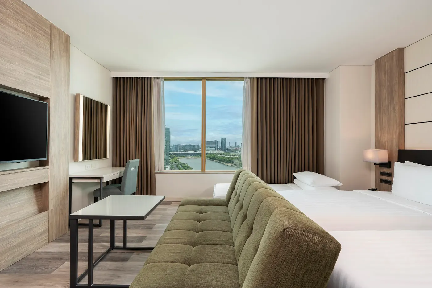Guest room with a window over the lake at Solaria Nishitetsu Hotel Bangkok