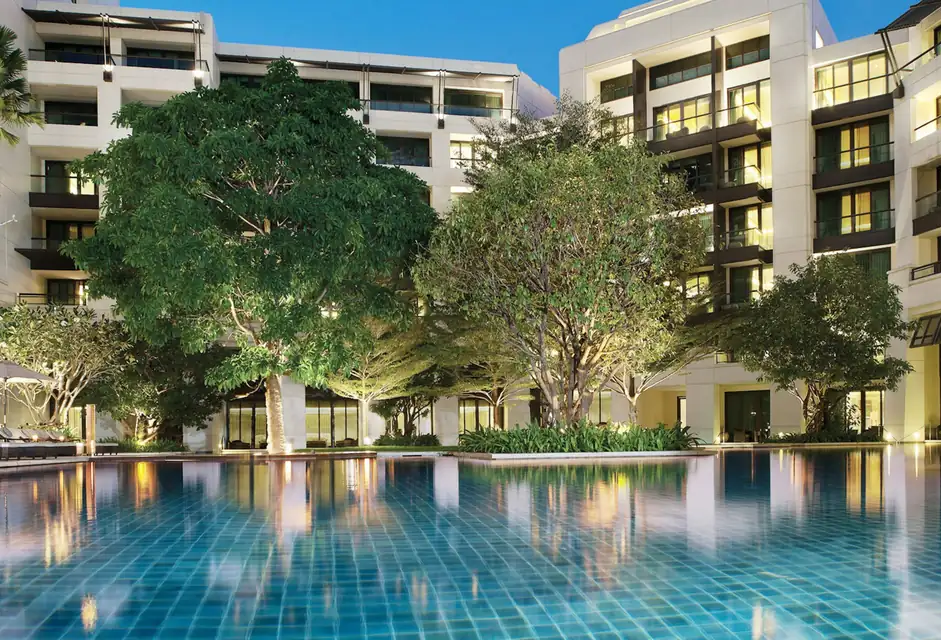 Siam Kempinski Hotel Bangkok wings around the garden pool via Expedia