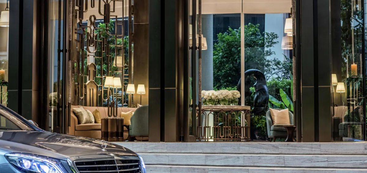 Waldorf Astoria Bangkok entrance on Ratchadamri Road via Expedia