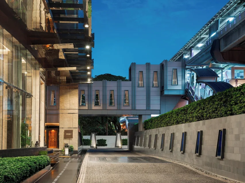 The St. Regis Bangkok entrance drive on Ratchadamri Road via Expedia