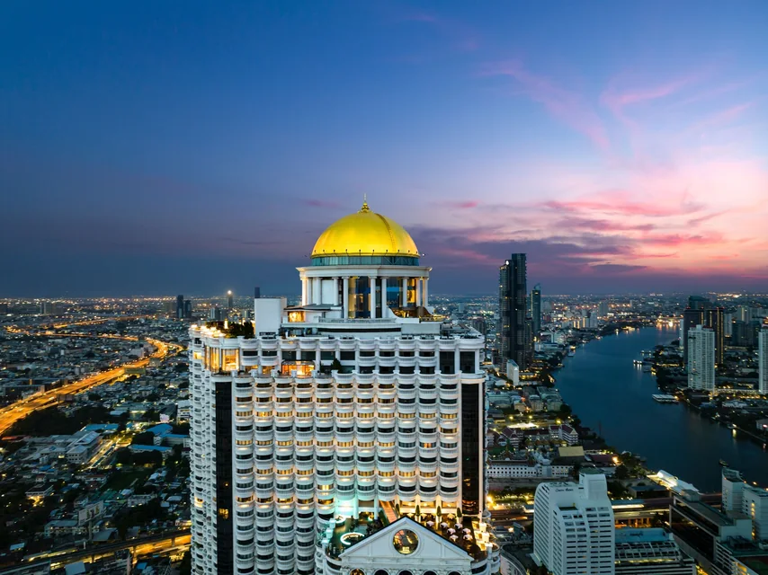 lebua at State Tower and its golden dome over the river at dusk via Expedia
