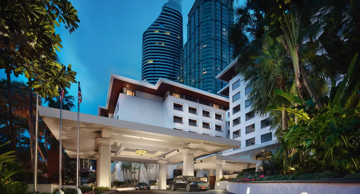 Anantara Siam Bangkok Hotel entrance at dusk via Expedia