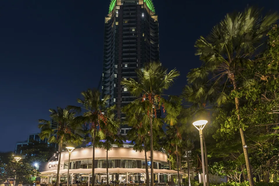 Chatrium Hotel Riverside Bangkok tower at night via Expedia