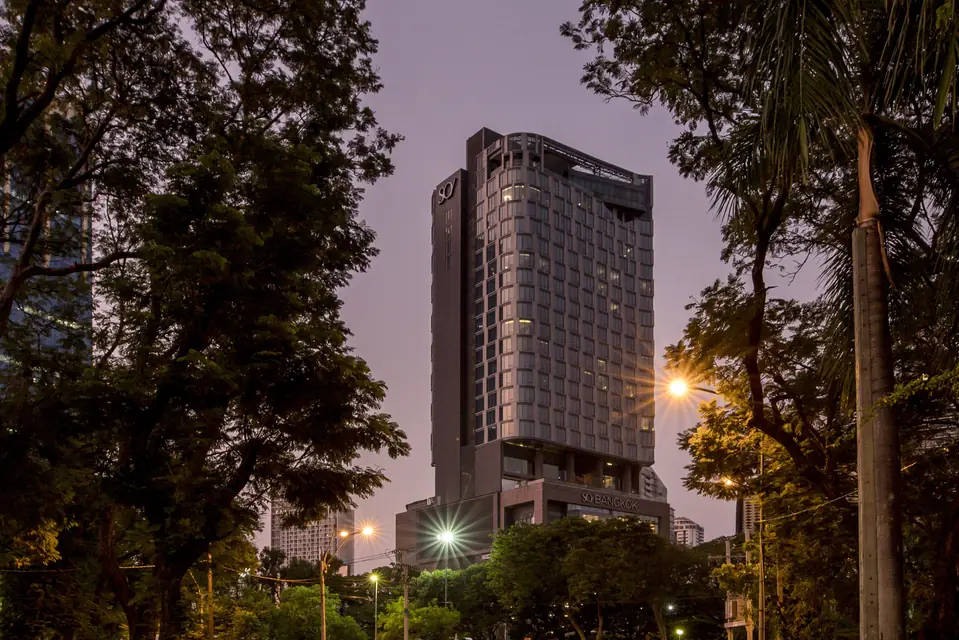 SO/ Bangkok tower beside Lumpini Park at dusk via Expedia
