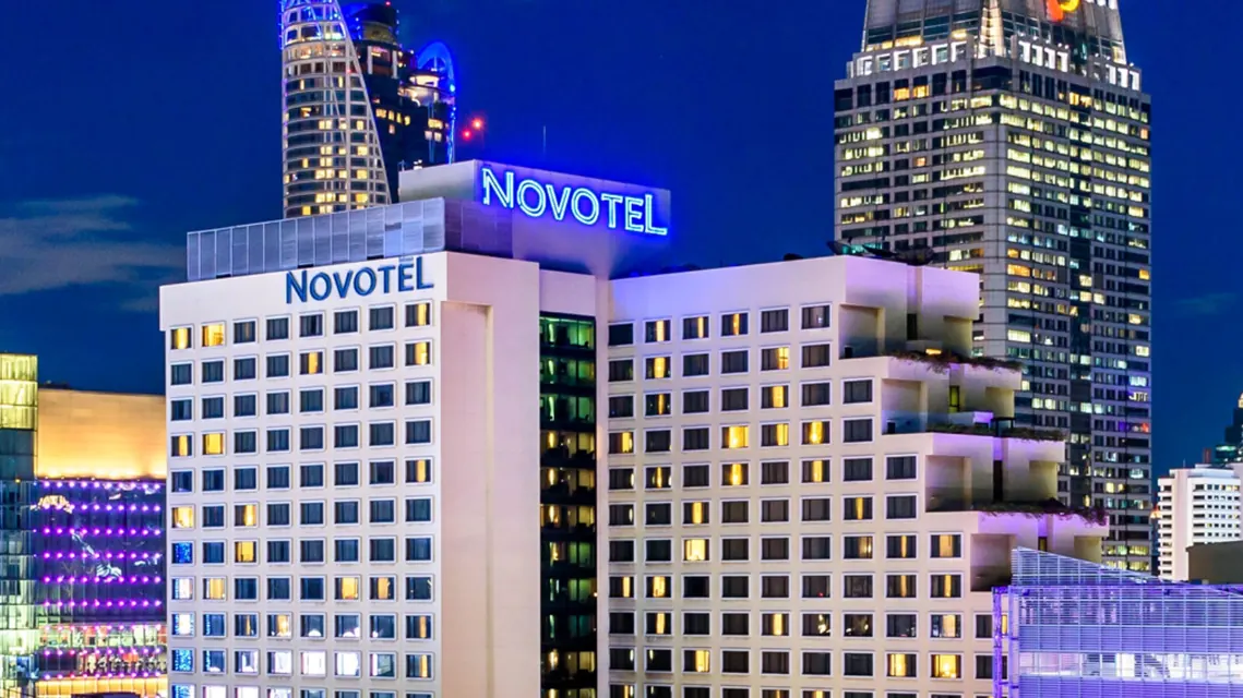 Novotel Bangkok on Siam Square tower at night via Expedia