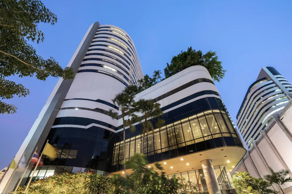 JW Marriott Hotel Bangkok tower on Sukhumvit Road at dusk via Expedia
