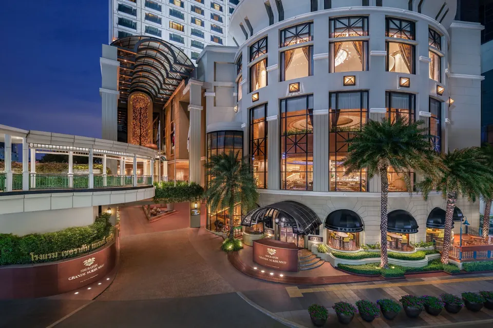 Sheraton Grande Sukhumvit facade and entrance at dusk via Expedia