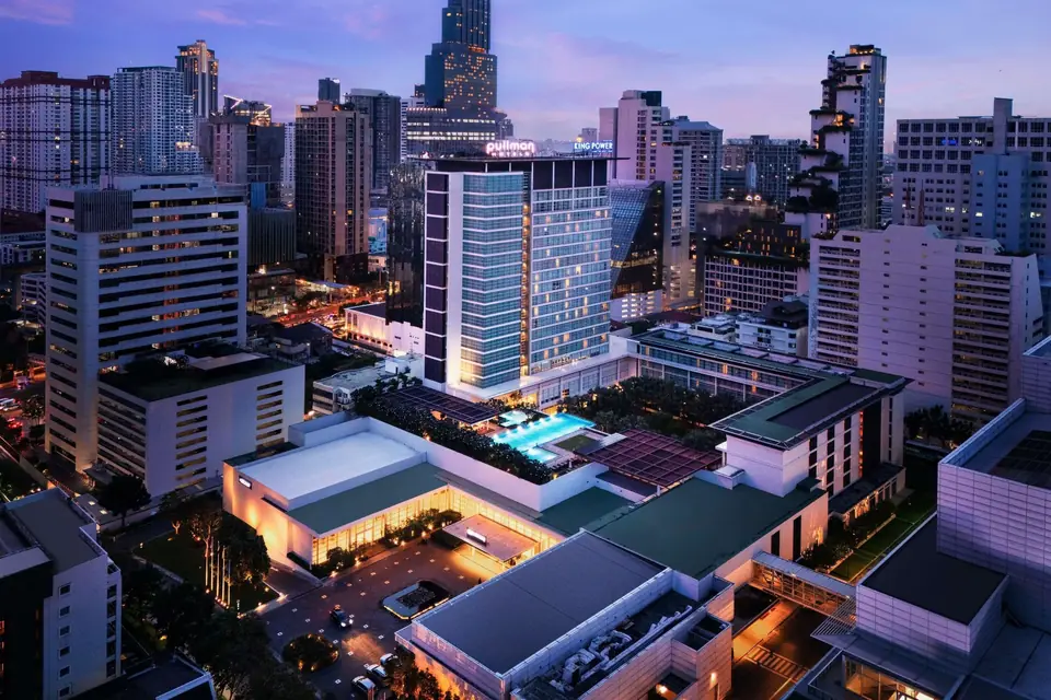 Pullman Bangkok King Power and its pool deck at dusk via Expedia