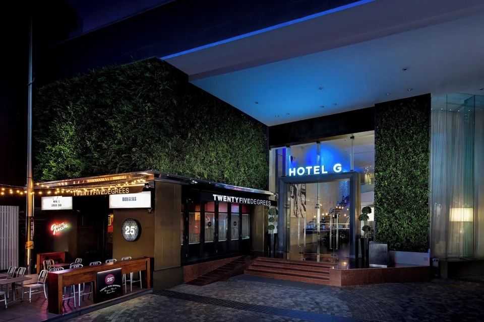 Pullman Bangkok Hotel G entrance on Silom at night via Expedia