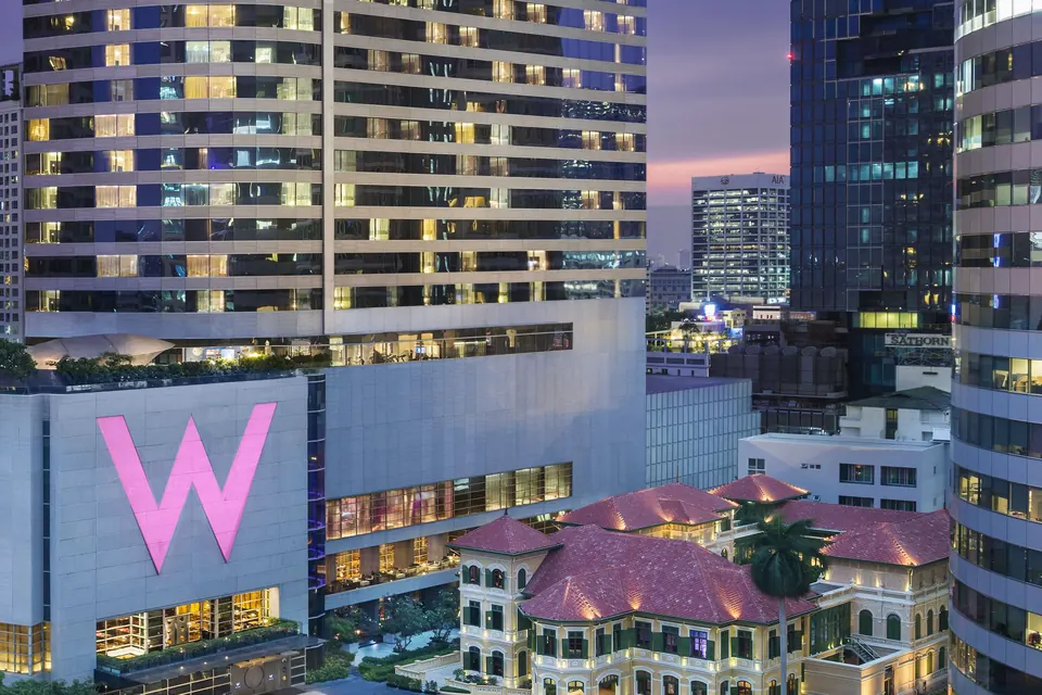 W Bangkok tower and The House on Sathorn mansion at dusk via Expedia