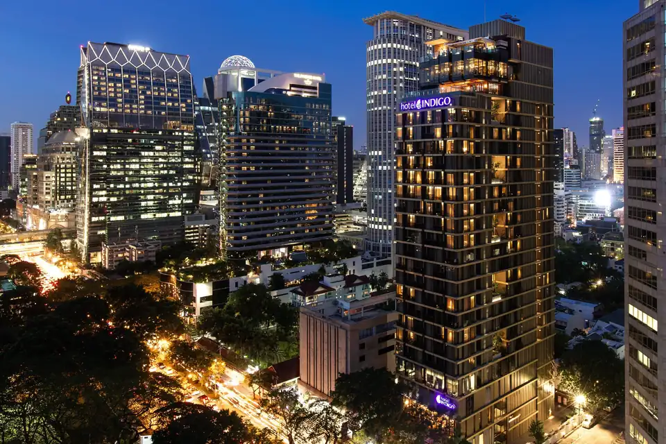 Hotel Indigo Bangkok Wireless Road tower lit at night via Expedia